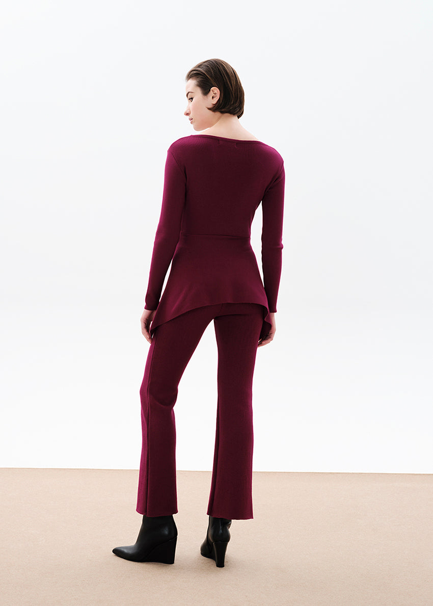 Unique asymmetrical modal blend top—soft, stretchy, with boat neckline and long sleeves. Perfect for chic, feminine winter outfits.