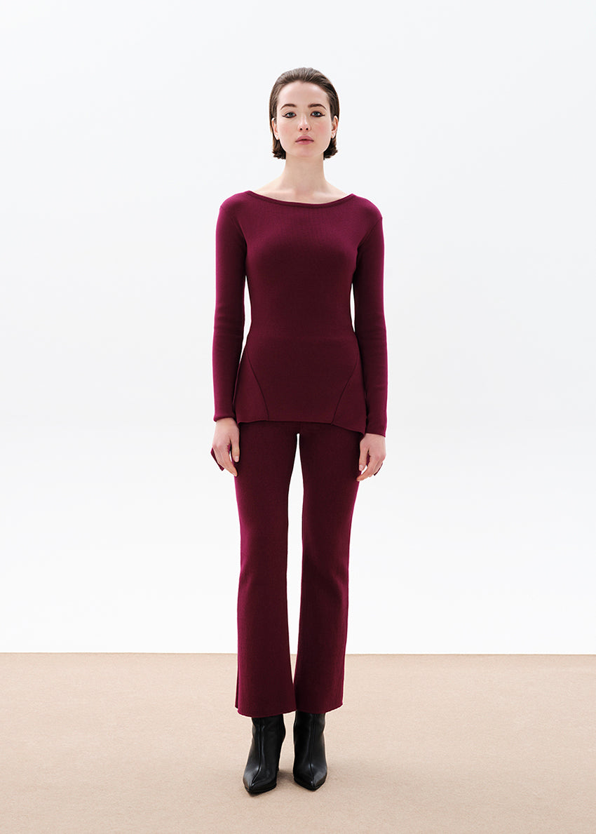 Unique asymmetrical modal blend top—soft, stretchy, with boat neckline and long sleeves. Perfect for chic, feminine winter outfits.