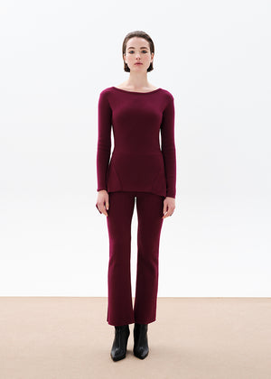 Unique asymmetrical modal blend top—soft, stretchy, with boat neckline and long sleeves. Perfect for chic, feminine winter outfits.