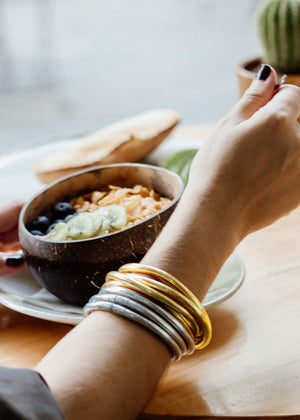 The 22Kt Gold Leaf Bracelets are a unique and special treasure, not just for their beauty and the delicate glow they add to the wearer, but also for their profound meaning and spiritual origin. Handcrafted by monks from the Buddhist temples of Southeast Asia, originating from Thailand, these bracelets are not merely decorative.