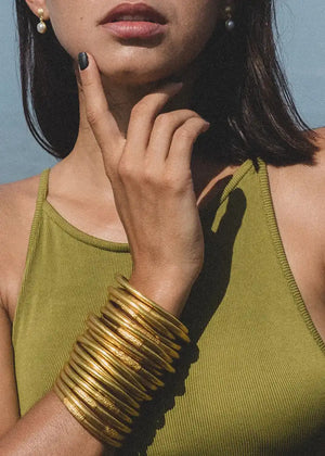 The 22Kt Gold Leaf Bracelets are a unique and special treasure, not just for their beauty and the delicate glow they add to the wearer, but also for their profound meaning and spiritual origin. Handcrafted by monks from the Buddhist temples of Southeast Asia, originating from Thailand, these bracelets are not merely decorative.