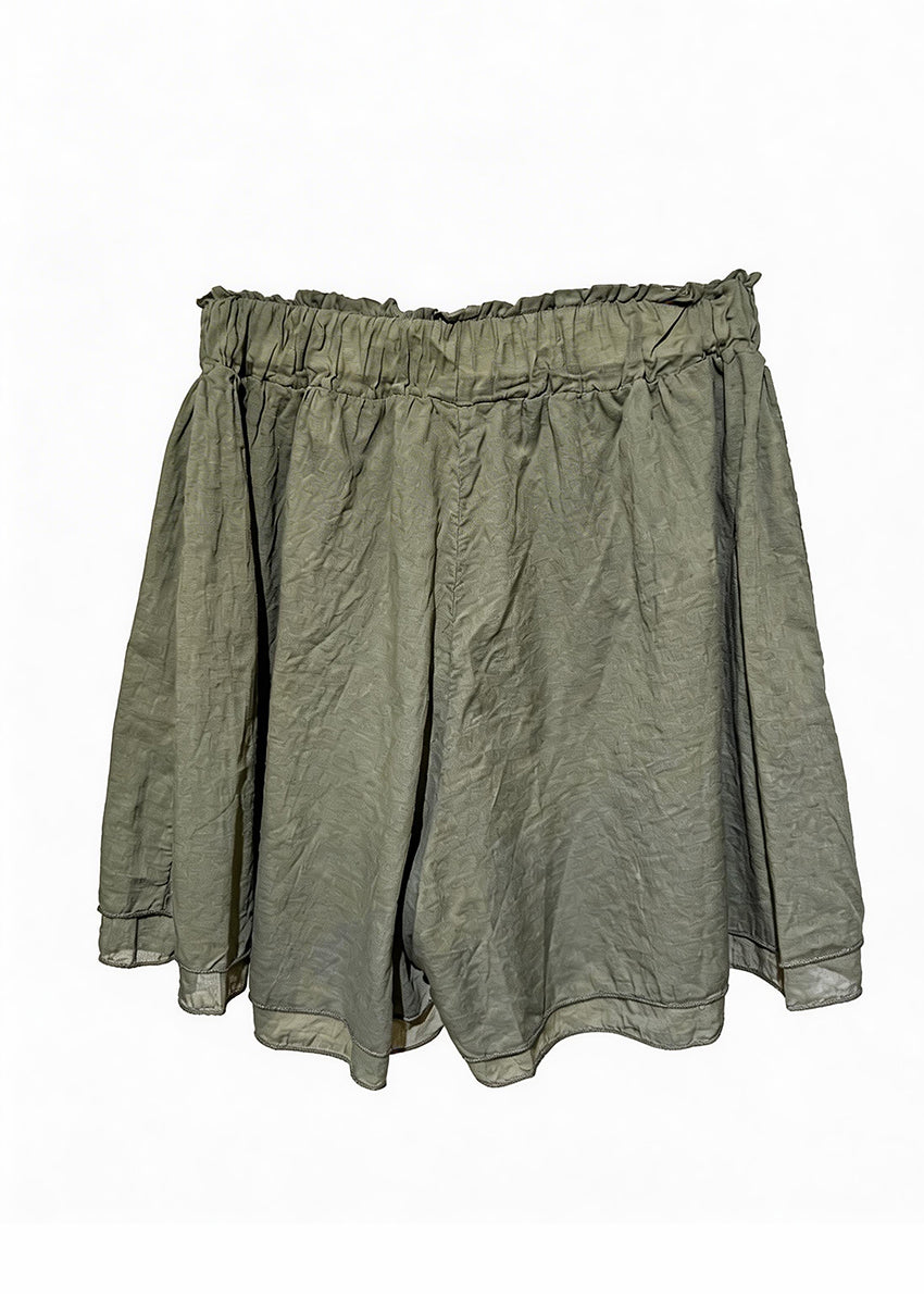 Green shorts on a white background
