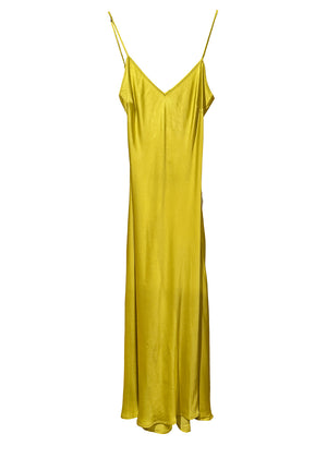 Midi slip yellow dress made of silky EcoVero viscose. It has a comfortable fit that hugs the silhouette and has dainty, adjustable shoulder straps. It is a passe-partout item perfect for all summer long.