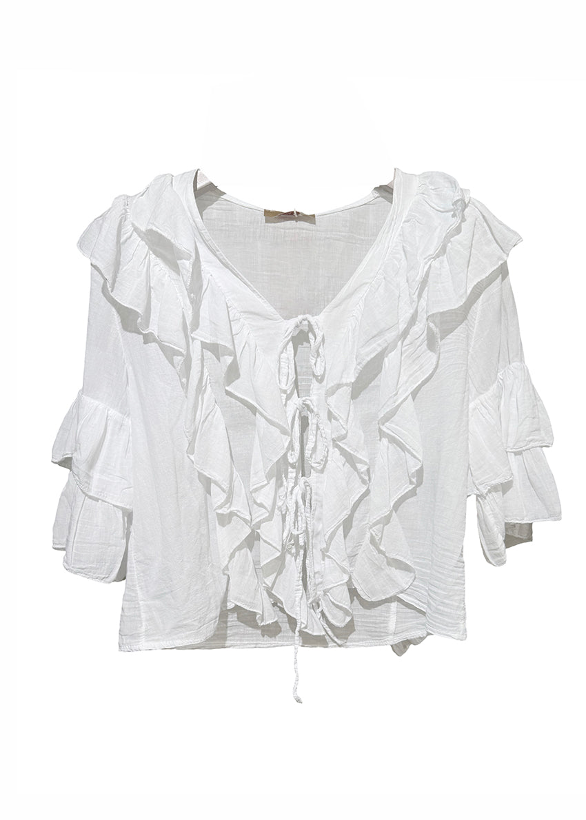 White blouse with ruffled details on a white background