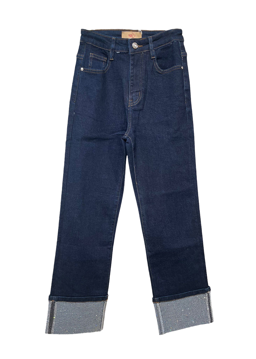 Pair of dark blue jeans with rolled-up cuffs on a white background