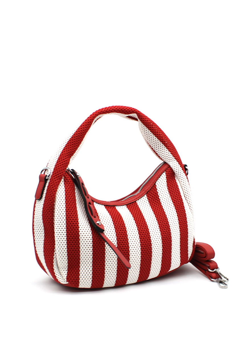 A handbag with a bold red and white striped design, featuring a crescent shape and a detachable strap.