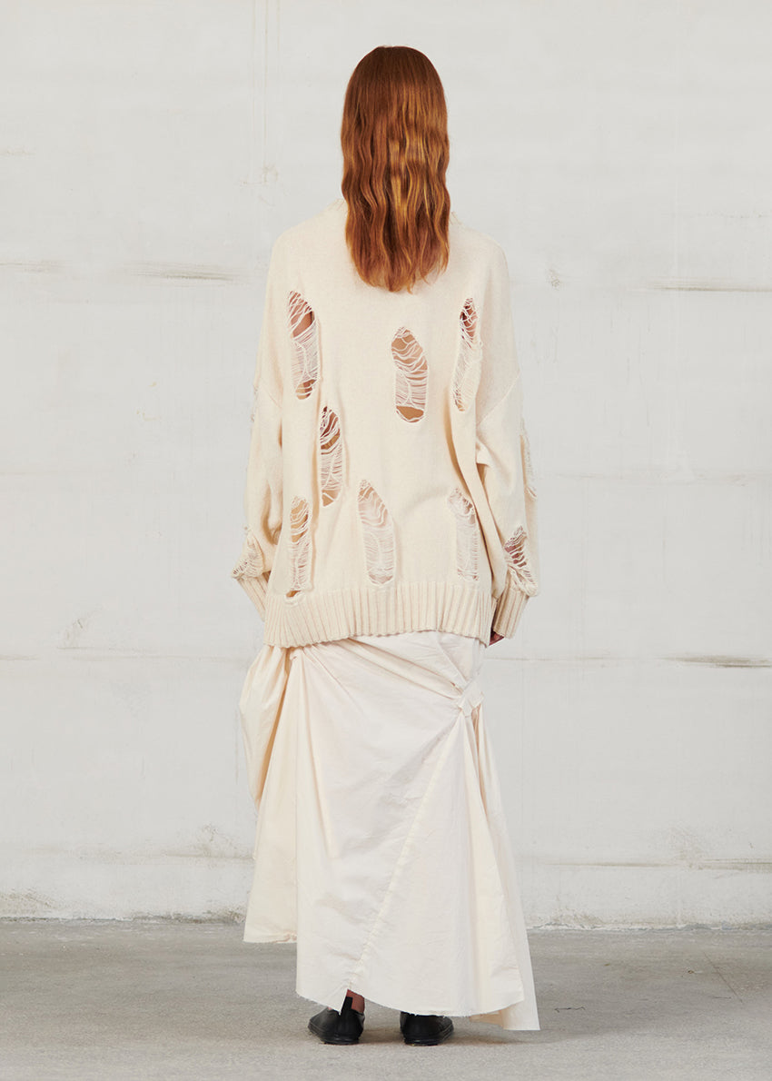 Knitted long sleeved blouse with grunge details, cut for an oversized fit, made of soft cotton yarn with ribbed finishes.