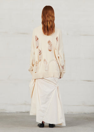 Knitted long sleeved blouse with grunge details, cut for an oversized fit, made of soft cotton yarn with ribbed finishes.