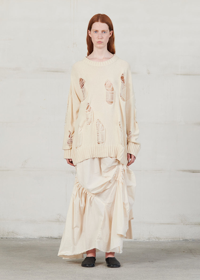 Knitted long sleeved blouse with grunge details, cut for an oversized fit, made of soft cotton yarn with ribbed finishes.