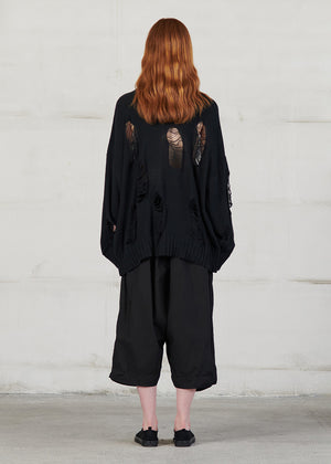 Knitted long sleeved blouse with grunge details, cut for an oversized fit, made of soft cotton yarn with ribbed finishes.