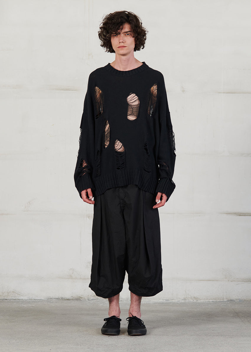 Knitted long sleeved blouse with grunge details, cut for an oversized fit, made of soft cotton yarn with ribbed finishes.