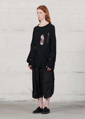 Knitted long sleeved blouse with grunge details, cut for an oversized fit, made of soft cotton yarn with ribbed finishes.