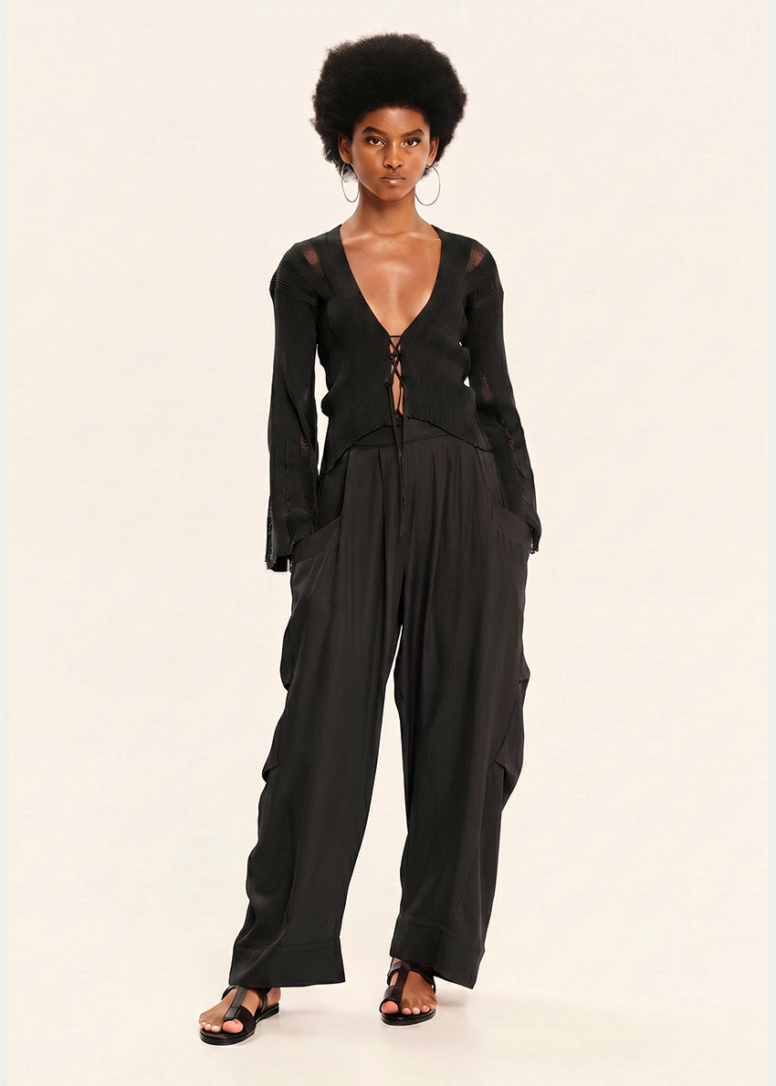 Woman wearing a black outfit on a white background