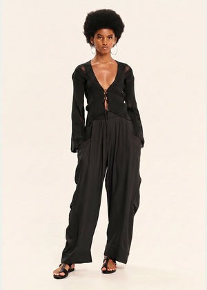 Woman wearing a black outfit on a white background
