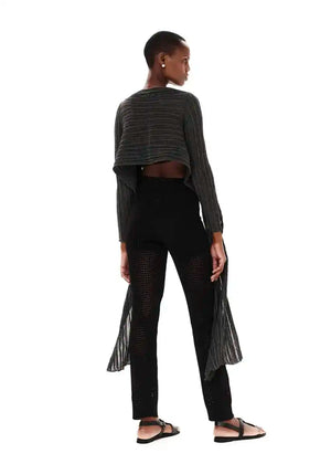 Versatile cardigan made of viscose and lurex yarn. It is a very special piece, designed exclusively by Kourbela and is a trademark for the brand. Suitable for glamorous evening appearances with a touch of shimmer.