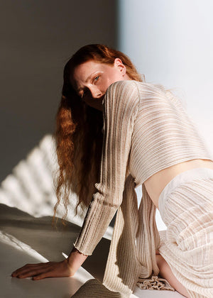 Versatile cardigan made of viscose and lurex yarn. It is a very special piece, designed exclusively by Kourbela and is a trademark for the brand. Suitable for glamorous evening appearances with a touch of shimmer.