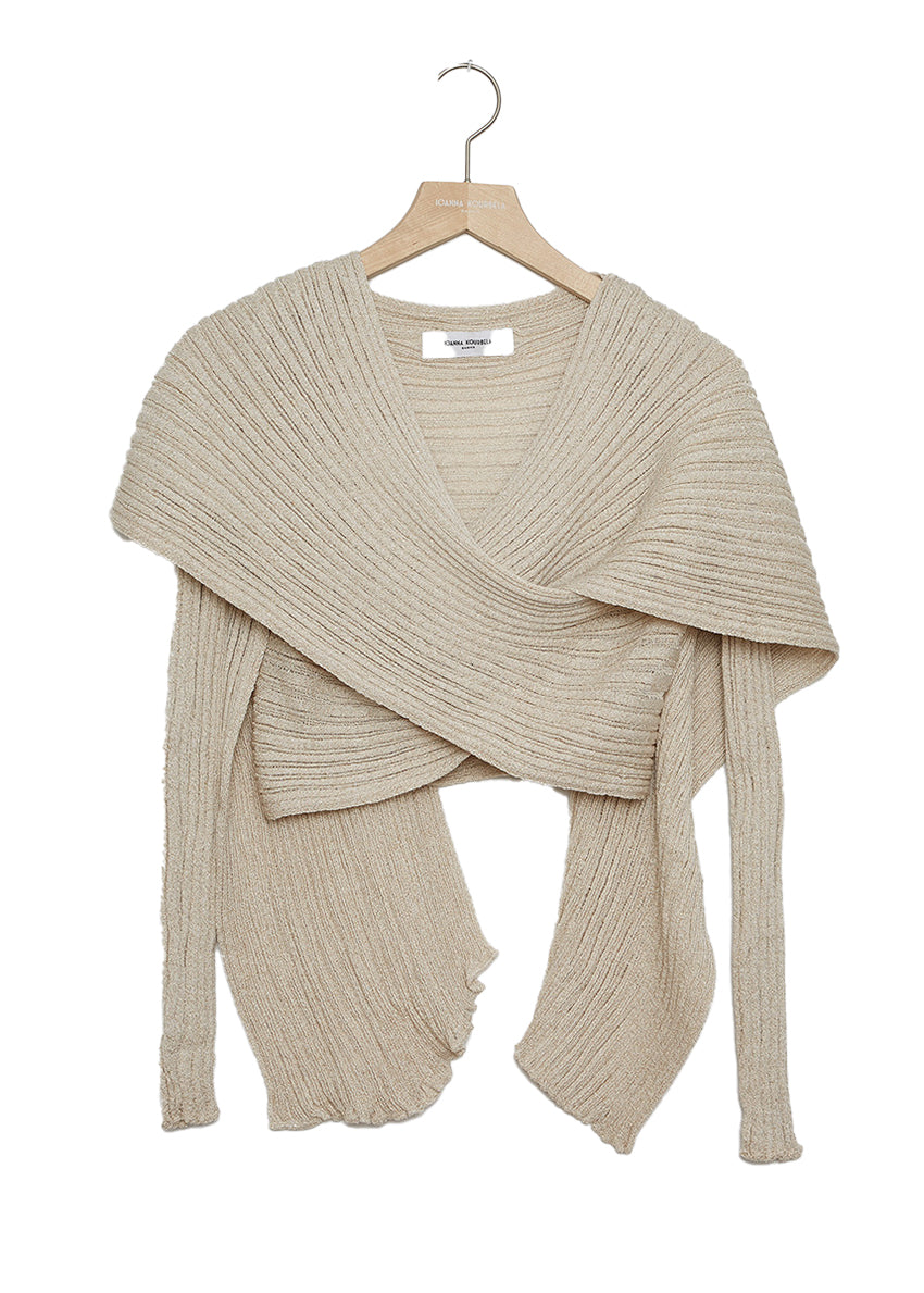 Versatile cardigan made of viscose and lurex yarn. It is a very special piece, designed exclusively by Kourbela and is a trademark for the brand. Suitable for glamorous evening appearances with a touch of shimmer.