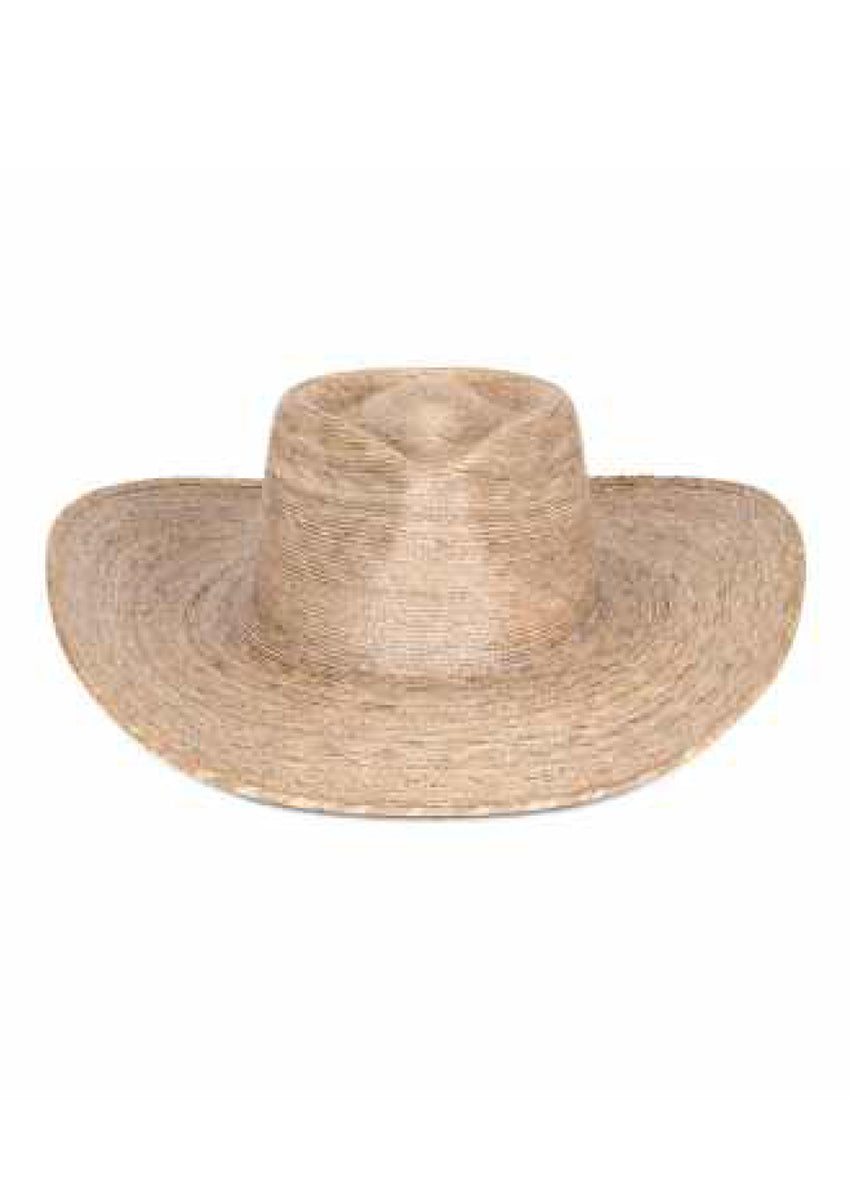 Woman wearing a straw hat and beige bikini against a white background