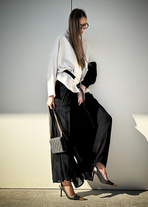 Step out in style with the TANTO trousers! These lightweight, breezy wonders feature a comfy elastic waist and side pockets for added convenience. The playful texture, recycled viscose has a slight soft shine over the surface and the softest texture on the skin.