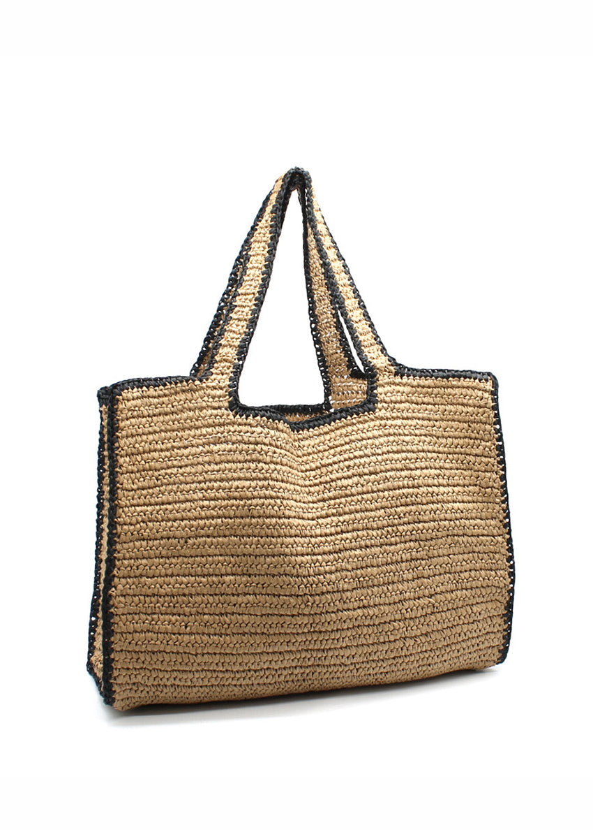 Woven straw-effect tote bag in a natural color with a contrasting black trim and edging. It's a spacious, structure silhouette with double top handles making perfect for city days, beach weekends and travel