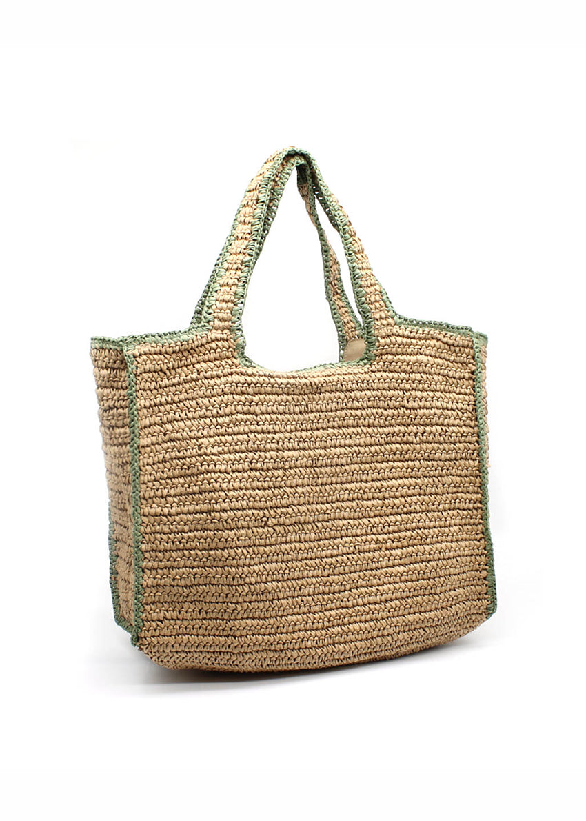 Woven straw-effect tote bag in a natural color with a contrasting green trim and edging. It's a spacious, structure silhouette with double top handles making perfect for city days, beach weekends and travel
