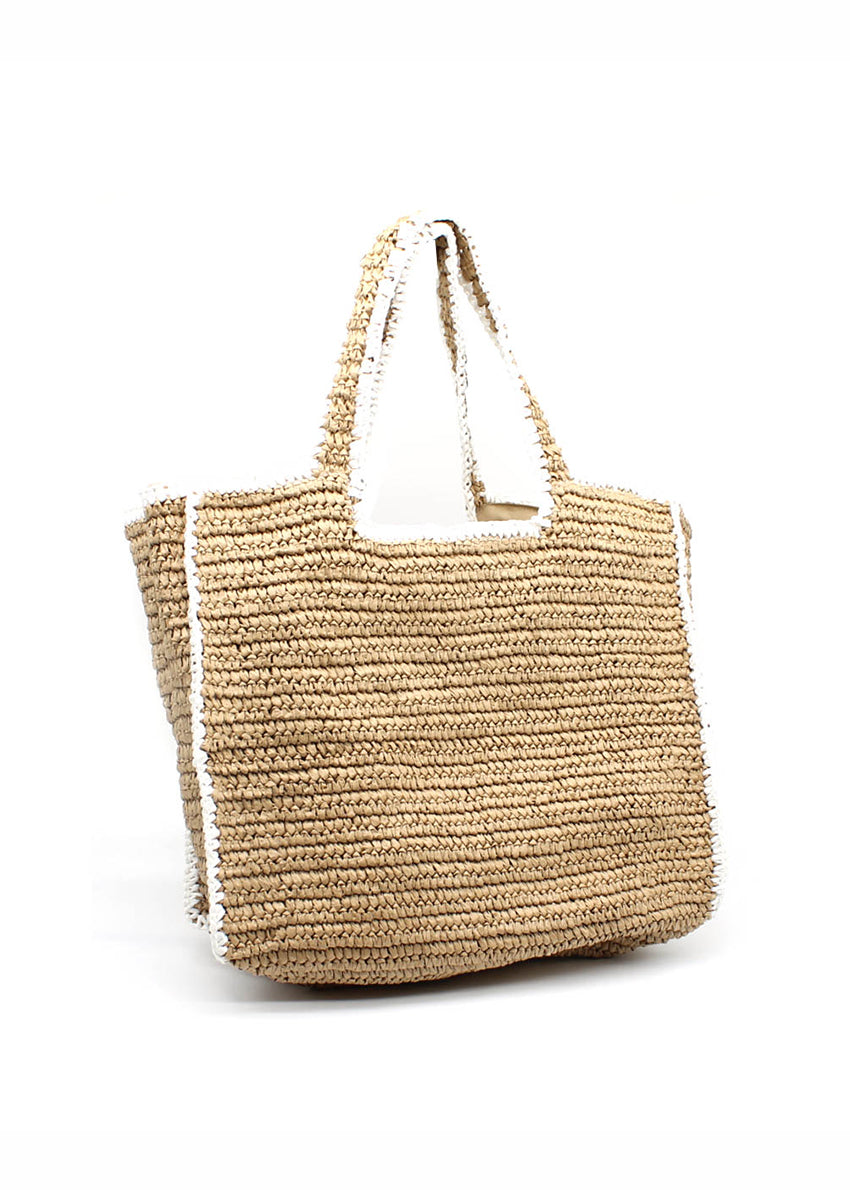 Woven straw-effect tote bag in a natural color with a contrasting white trim and edging. It's a spacious, structure silhouette with double top handles making perfect for city days, beach weekends and travel