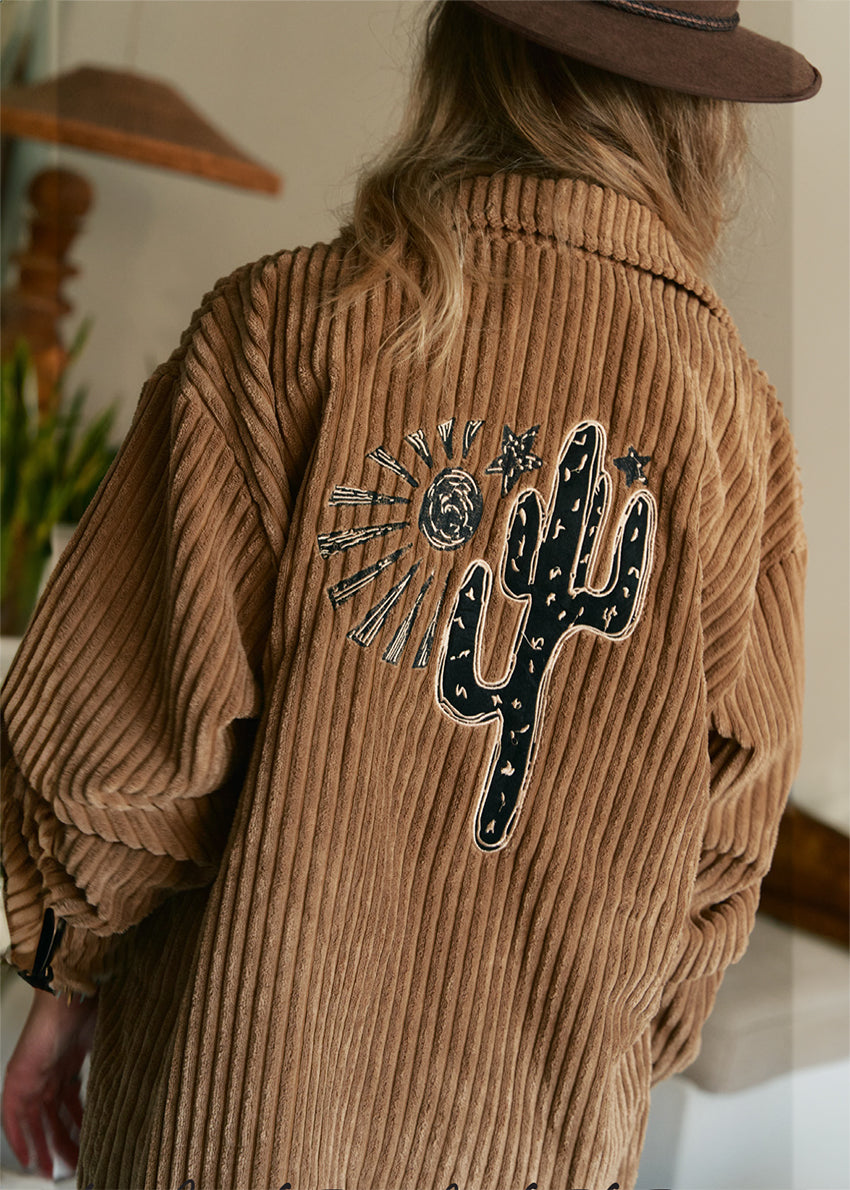 A vintage-inspired style, this timeless cord Shirt/Jacket from Jaase is featured in a classic silhouette with button up front closure and embroidered fabrication for an extra special finish. Button up, long sleeve, embroidered details, long length