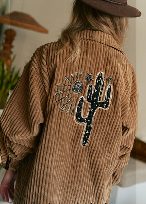 A vintage-inspired style, this timeless cord Shirt/Jacket from Jaase is featured in a classic silhouette with button up front closure and embroidered fabrication for an extra special finish. Button up, long sleeve, embroidered details, long length
