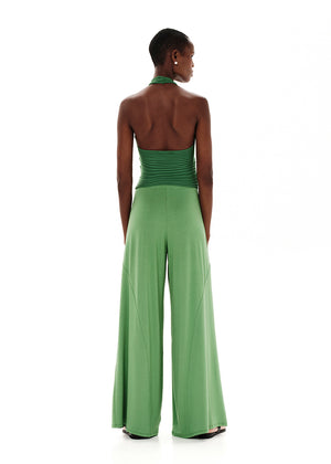 Knitted green crop top with a twist at the bust, halter neckline and an open back.Knitted crop top in a form – fitting silhouette.It has a twist in the bust area, a halter neckline with a subtle ‘V’ and an open back