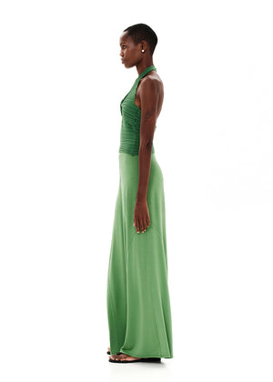 Knitted green crop top with a twist at the bust, halter neckline and an open back.Knitted crop top in a form – fitting silhouette.It has a twist in the bust area, a halter neckline with a subtle ‘V’ and an open back