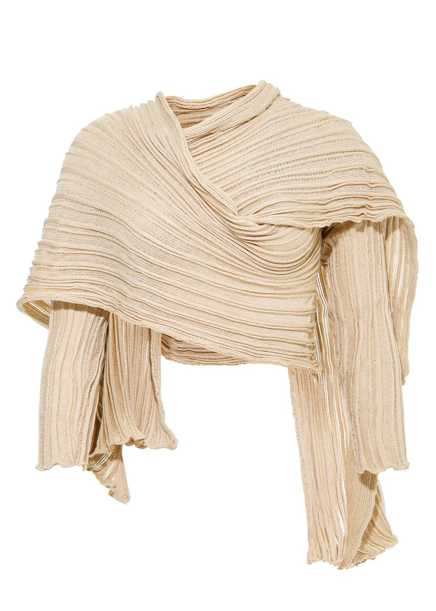 Perforated versatile knit cardigan with asymmetrical panels at the front. Made from 100% Greek cotton. The thick horizontal archetypal knitting allows for a loose flow and a beautiful fit. A very special piece, drawing inspiration from pleats