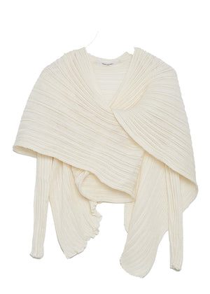 Perforated versatile knit cardigan with asymmetrical panels at the front. Made from 100% Greek cotton. The thick horizontal archetypal knitting allows for a loose flow and a beautiful fit. A very special piece, drawing inspiration from pleats