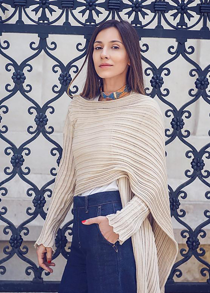 Perforated versatile knit cardigan with asymmetrical panels at the front. Made from 100% Greek cotton. The thick horizontal archetypal knitting allows for a loose flow and a beautiful fit. A very special piece, drawing inspiration from pleats