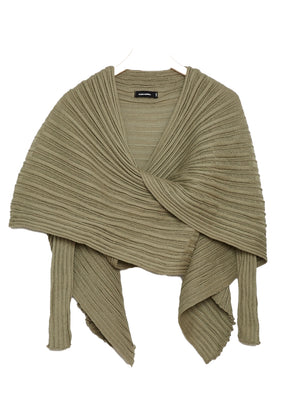 Perforated versatile knit cardigan with asymmetrical panels at the front. Made from 100% Greek cotton. The thick horizontal archetypal knitting allows for a loose flow and a beautiful fit. A very special piece, drawing inspiration from pleats