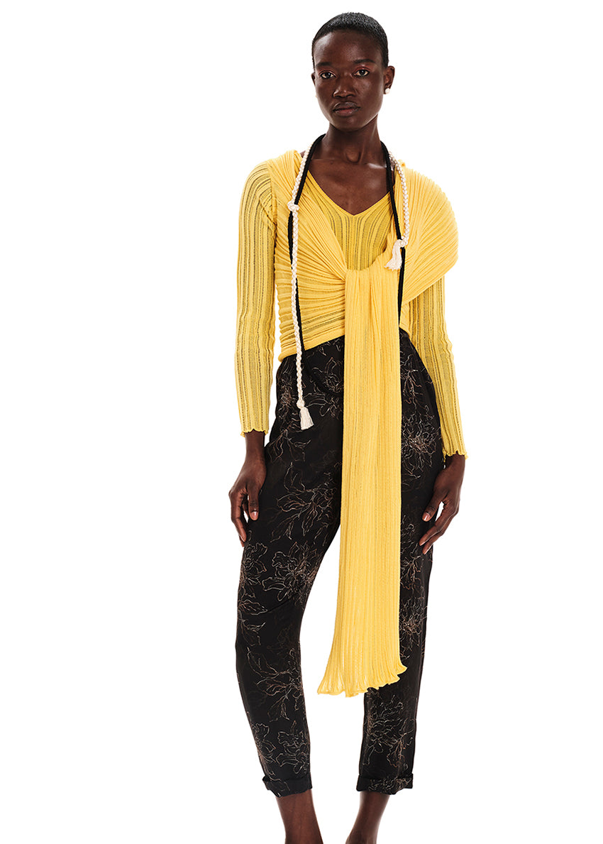 Perforated versatile knit cardigan with asymmetrical panels at the front. Made from 100% Greek cotton. The thick horizontal archetypal knitting allows for a loose flow and a beautiful fit. A very special piece, drawing inspiration from pleats