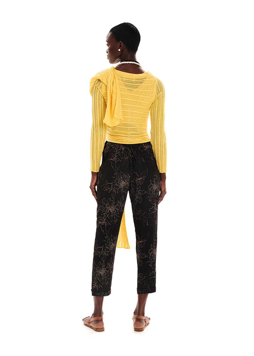 Perforated versatile knit cardigan with asymmetrical panels at the front. Made from 100% Greek cotton. The thick horizontal archetypal knitting allows for a loose flow and a beautiful fit. A very special piece, drawing inspiration from pleats