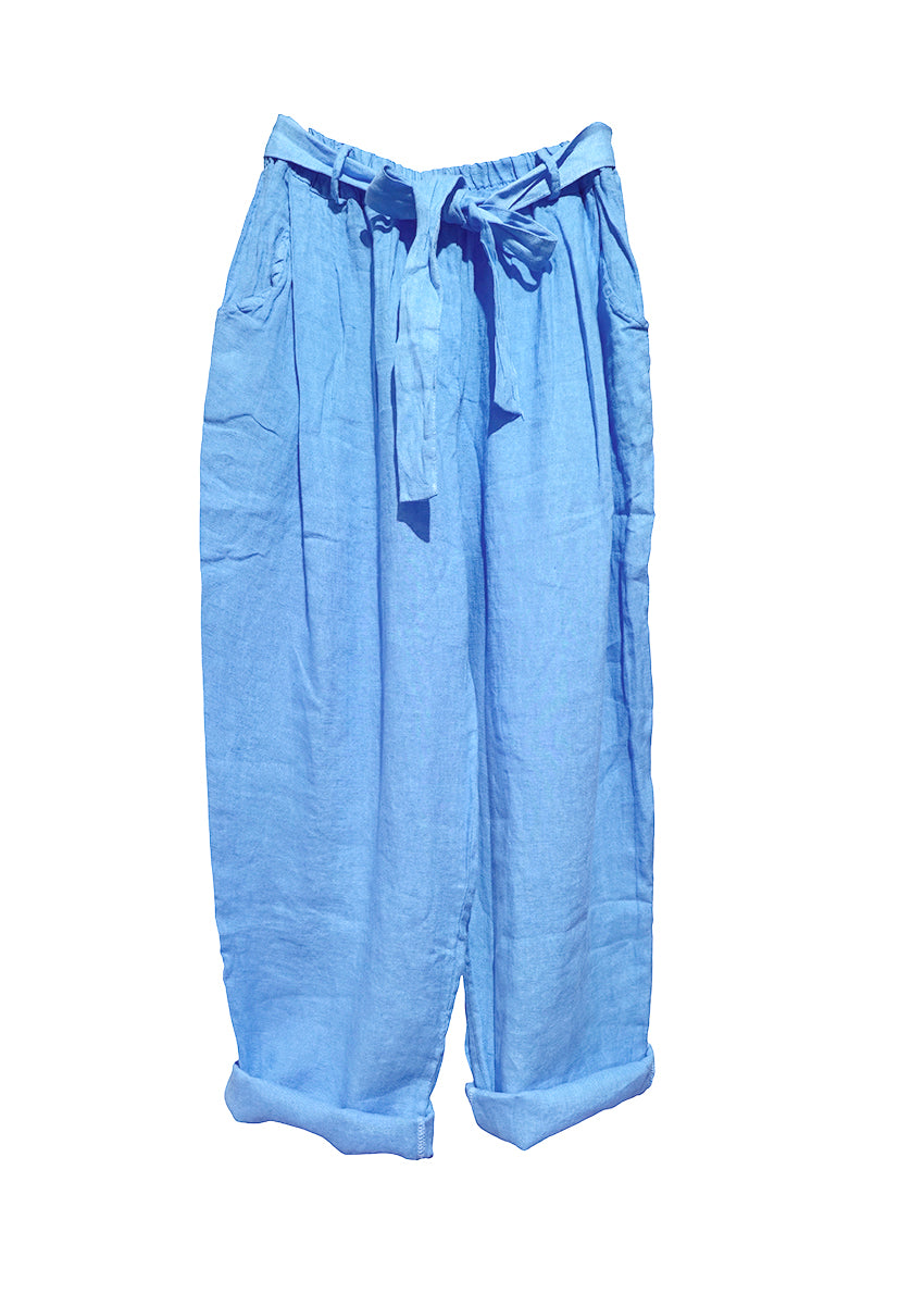 A pair of light blue linen pants with an adjustable tie-waist design.