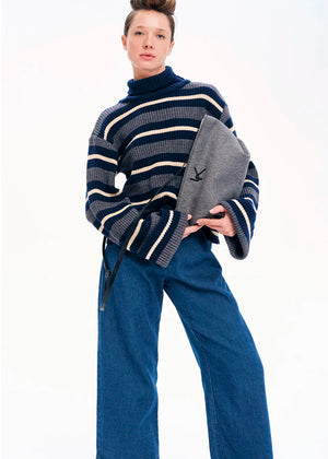 Knit long - sleeved turtleneck top.Knit long - sleeved top with stripes made of a blend of two different fabrics in a comfortable fit that features bell sleeves and a turtleneck neckline.