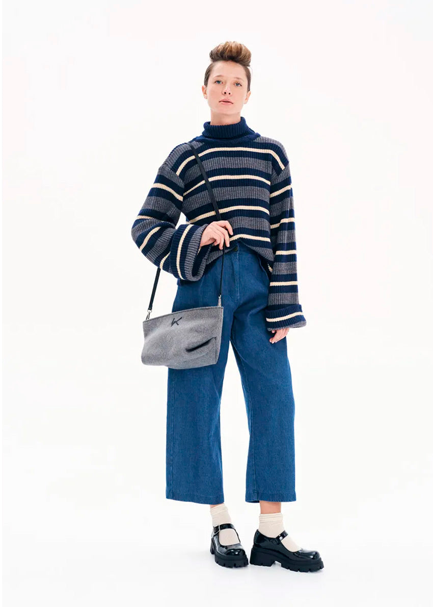 Knit long - sleeved turtleneck top.Knit long - sleeved top with stripes made of a blend of two different fabrics in a comfortable fit that features bell sleeves and a turtleneck neckline.