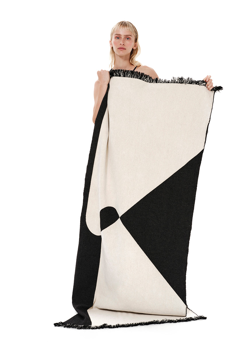 Wrap yourself in comfort with this luxurious 100% cotton beach towel—thick, plush, and absorbent like your favorite cozy rug. Designed to keep you warm after a swim and dry you off in no time, it features the brand’s signature monogram woven along its entire length