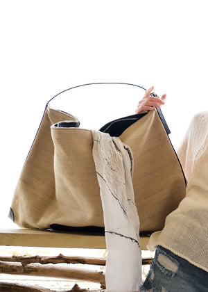 Summer style with our oversized shoulder bag, crafted from premium artificial leather and straw.