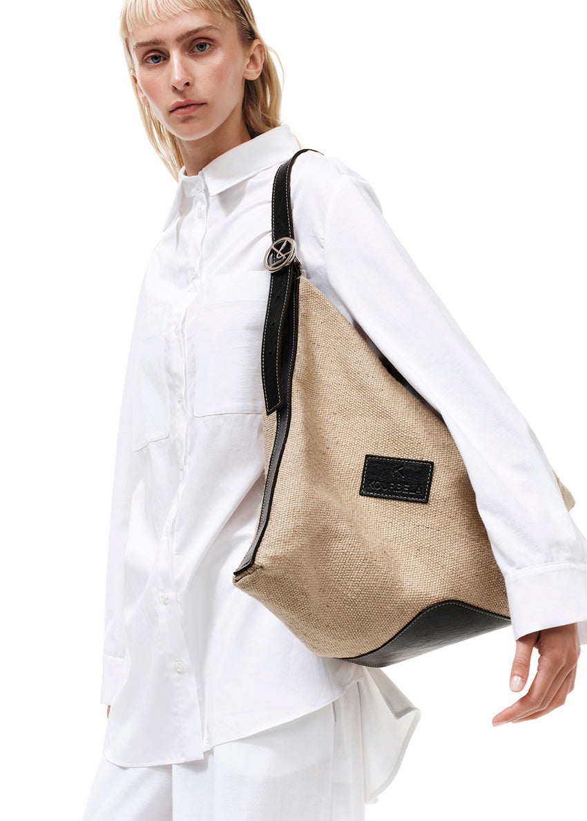 Summer style with our oversized shoulder bag, crafted from premium artificial leather and straw.