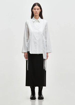 Long straight line skirt with side pockets and a slit at the back, made of blended cool wool-type viscose fabric. TUBO features a fixed waistband with elastic at the back, belt loops and closes with two front buttons and a zipper.