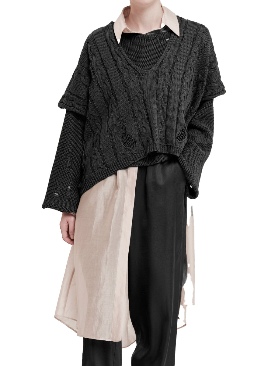 Beige cable knit vest on a white background