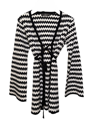Black and white striped cardigan with a belt on a white background