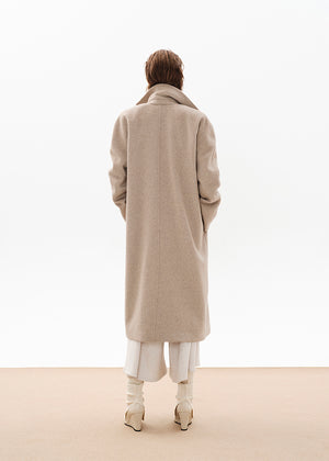 Person wearing a beige wool coat from the back on a white background 
