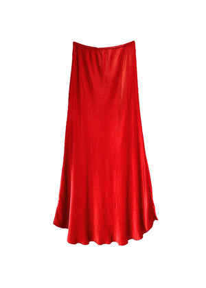A red satin midi-length skirt with a high-rise waist and a flaring hem.