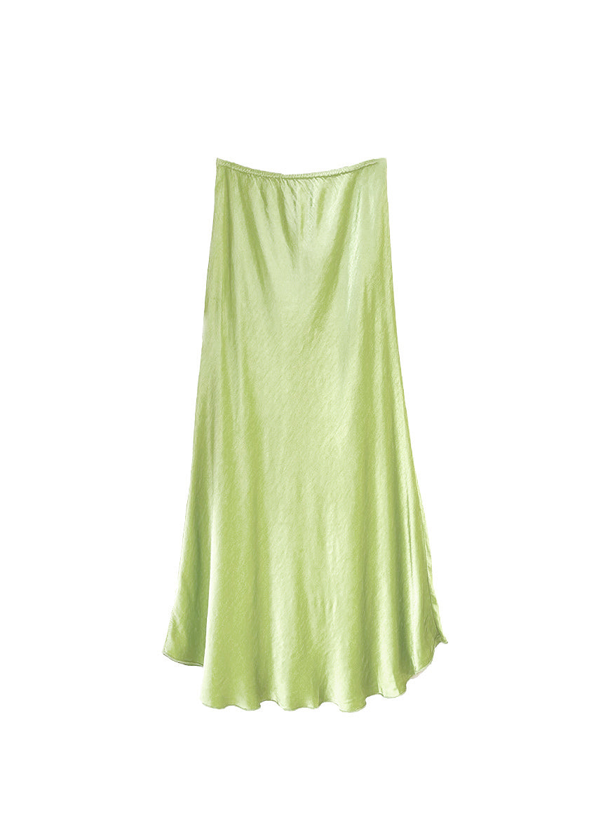 Light yellow green satin skirt on a white background