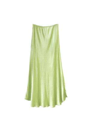 Light yellow green satin skirt on a white background