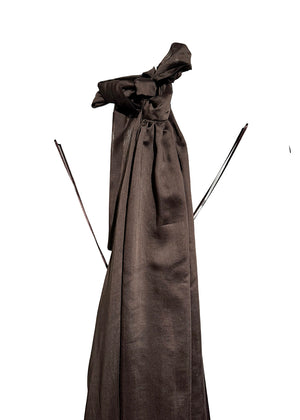 Brown dress with a large bow on a white background